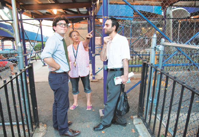 While canvassing in the Southside of Williamsburg, Lincoln Restler (at left) stops to speak with a neighborhood resident and a campaign member, Marcos Masri. Photo by Benjamin Lozovsky