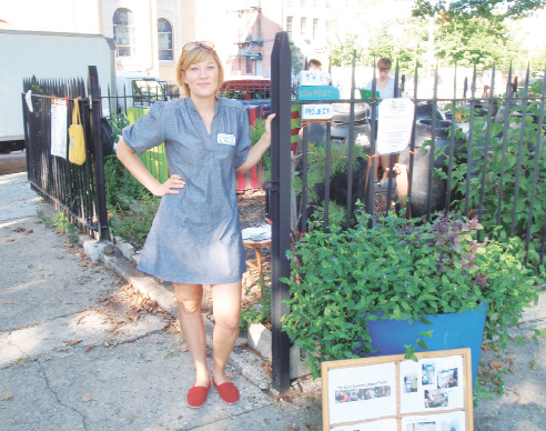 Kate Zidar, an environmental planner, and founding member of North Brooklyn Compost Project in McCarren Park (in background), shares the democratic party ticket for state committee with Lincoln Restler.  Photo by Sarah Baker