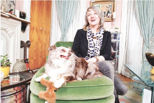 Kelley Shields with Otto, a toy Australian Shepherd in her Greenpoint home which she shares with husband, artist Brian Sullivan and daughters Soaerse and Ita. Photo by Benjamin Lozovsky 