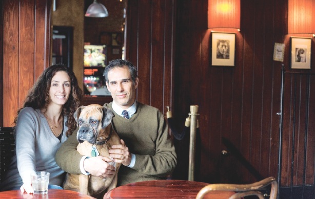 Ali and Ari Zablozki, owners of Zablozki's Bar, and their dog Millie. Photo by Ashley Corbin-Teich